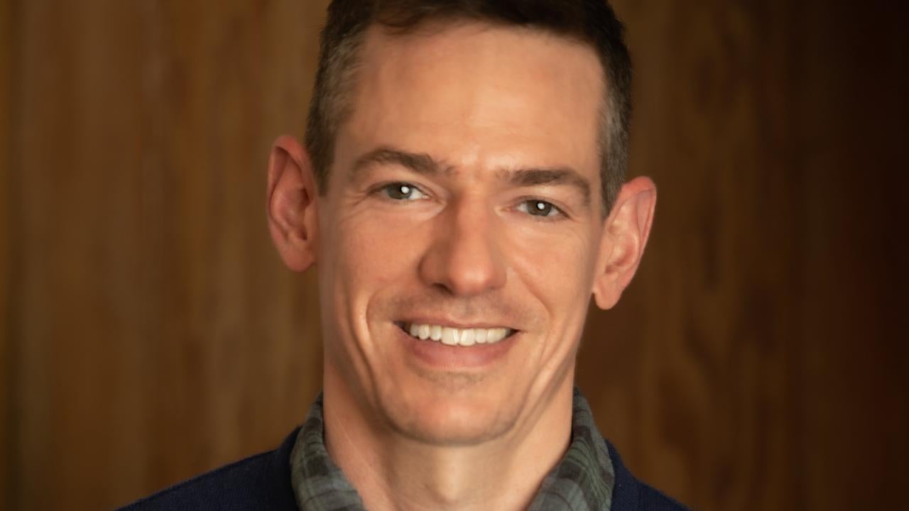 Headshot of John Pachankis smiling
