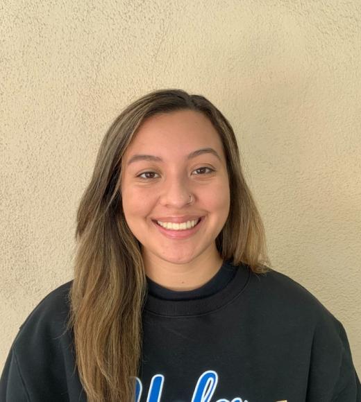 A young woman in a UCLA sweatshirt 