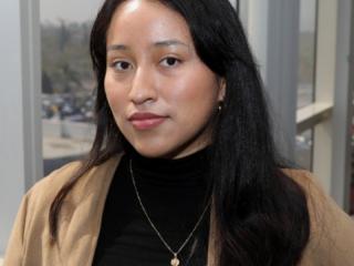 A young woman with straight dark hair